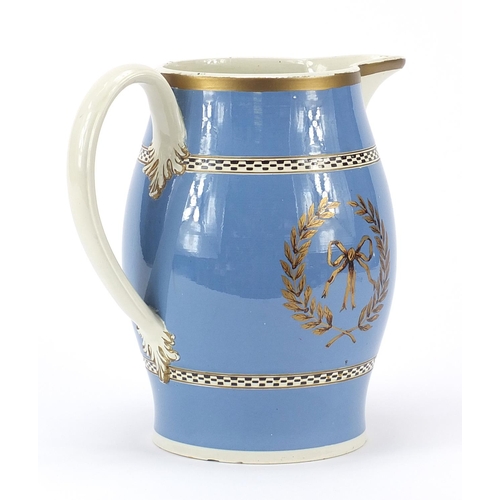 346 - 18th century creamware jug gilded with armorial stag and bow, dated 1787, 22cm high