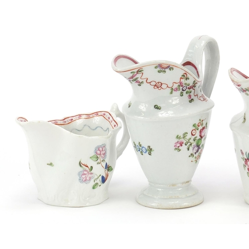 344 - Four 18th century Newhall cream jugs hand painted with flowers, the largest 11.5cm high