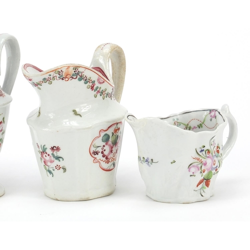 344 - Four 18th century Newhall cream jugs hand painted with flowers, the largest 11.5cm high