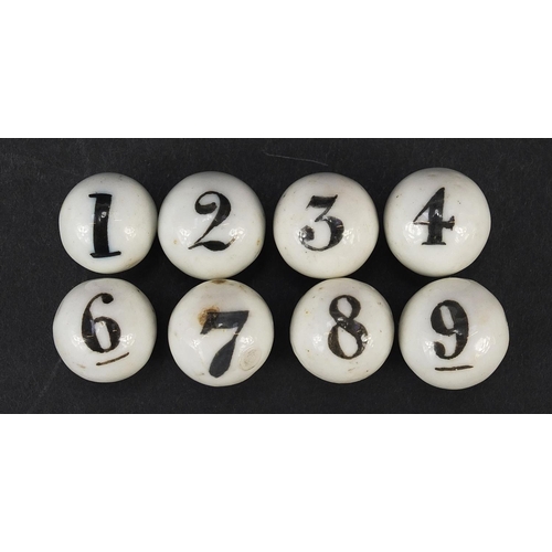 299 - Eight Victorian porcelain numbered balls, each approximately 17mm in diameter