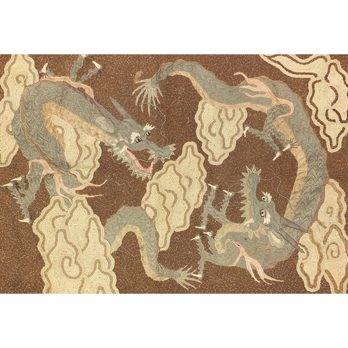 86 - Chinese embroidered wall hanging depicting two three toed dragons amongst clouds, 102cm x 70cm