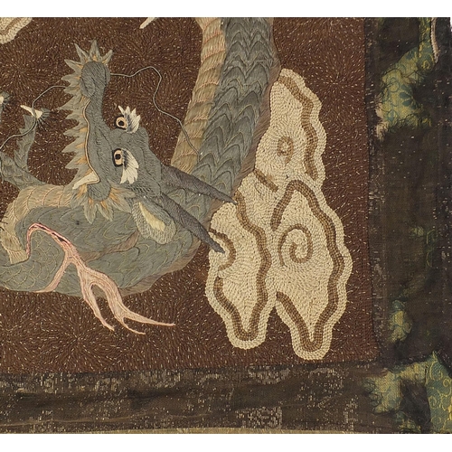 86 - Chinese embroidered wall hanging depicting two three toed dragons amongst clouds, 102cm x 70cm