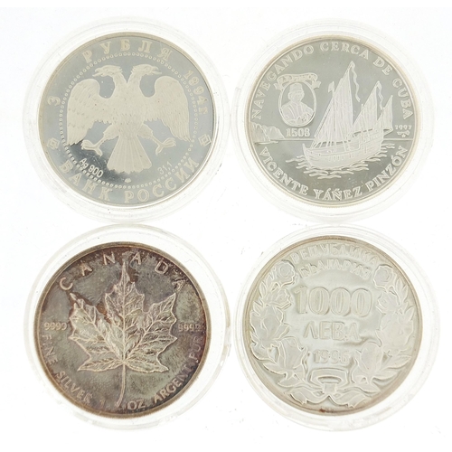 2546 - Four silver crown sized coins in protective cases including a Queen Elizabeth five dollars, approxim... 