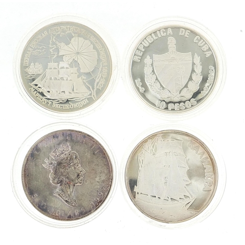 2546 - Four silver crown sized coins in protective cases including a Queen Elizabeth five dollars, approxim... 