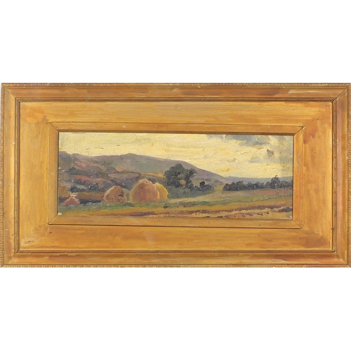 641 - Hayricks before a landscape, oil on canvas board, mounted and framed, 47cm x 16.5cm excluding the mo... 