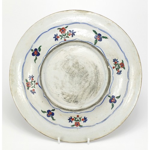 207 - Turkish Iznik pottery plate hand painted with flowers, 31cm in diameter