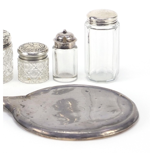 1093 - Five Victorian and later silver mounted cut glass jars and a silver backed hand mirror including J &... 