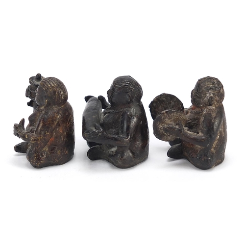 118 - Three Chinese bronzes of musicians seated playing various instruments, the largest 4cm high