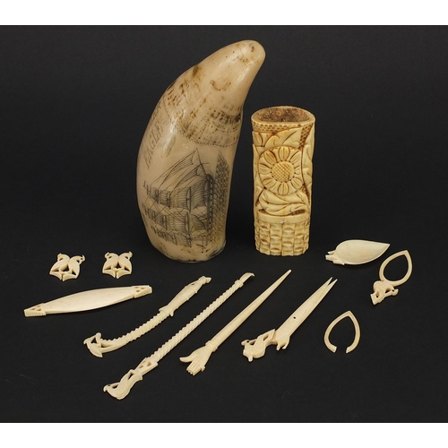 1396 - Ivory, bone and resin objects including scrimshaw, the largest 13cm in length