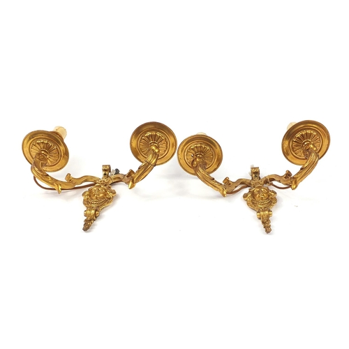 271 - Pair of French style two branch gilt metal wall sconces with masks, 29cm high x 29cm wide