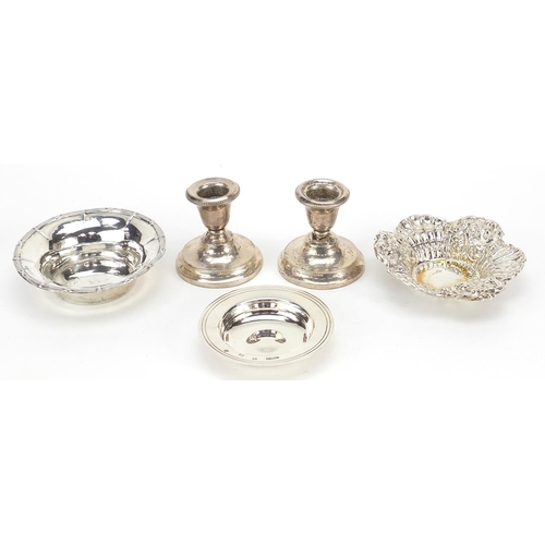 2422 - Victorian and later silver items comprising a pair of dwarf candlesticks, two circular dishes and a ... 