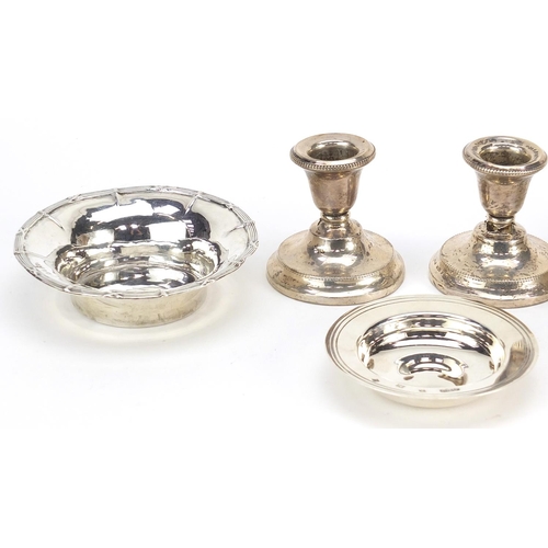 2422 - Victorian and later silver items comprising a pair of dwarf candlesticks, two circular dishes and a ... 