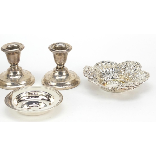 2422 - Victorian and later silver items comprising a pair of dwarf candlesticks, two circular dishes and a ... 