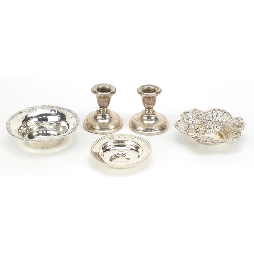 2422 - Victorian and later silver items comprising a pair of dwarf candlesticks, two circular dishes and a ... 