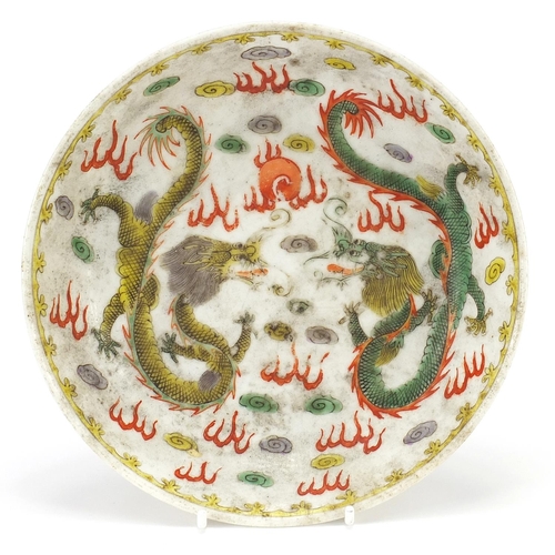 6 - Chinese porcelain dragon dish hand painted in the wucai palette with two dragons chasing a flaming p... 