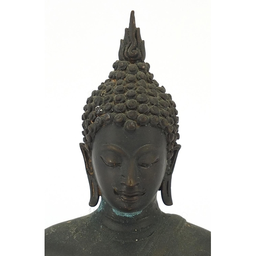 116 - Burmese patinated bronze figure of seated Buddha, 21.5cm high