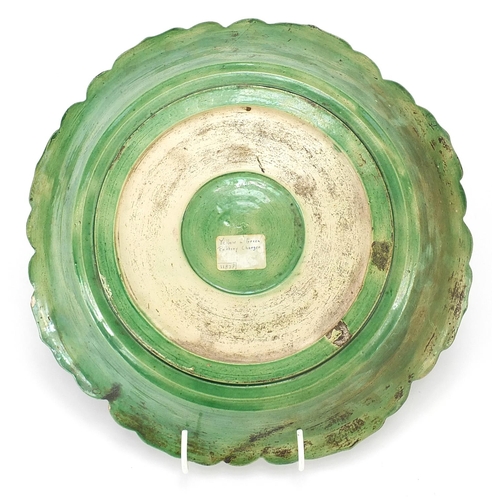 7 - Chinese green and yellow glazed porcelain dish decorated in relief with figures in a palace setting,... 