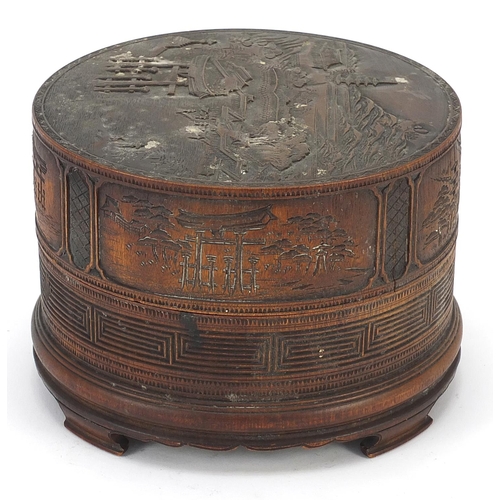 57 - Chinese cylindrical bamboo box and cover finely carved with a landscape, 11.5cm high x 16.5cm in dia... 