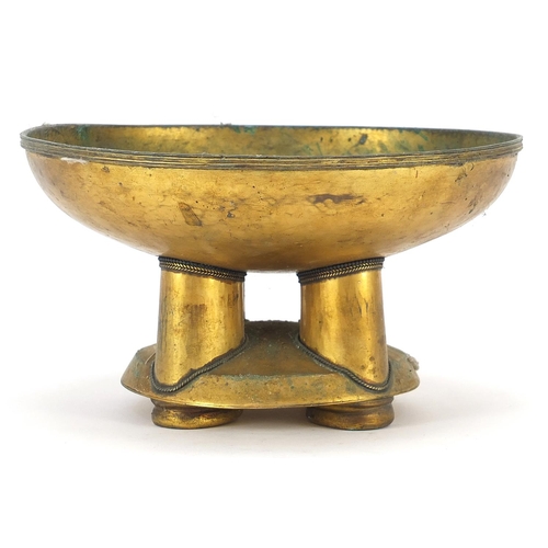 214 - African tribal interest gilt metal pedestal bowl with four columns, 11.5cm high x 21.5cm in diameter