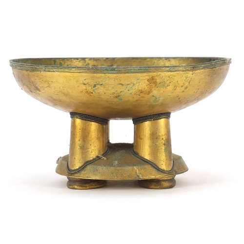 214 - African tribal interest gilt metal pedestal bowl with four columns, 11.5cm high x 21.5cm in diameter
