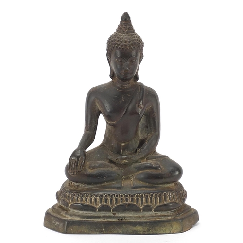 115 - Burmese patinated bronze figure of seated Buddha, 20.5cm high