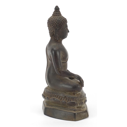 115 - Burmese patinated bronze figure of seated Buddha, 20.5cm high