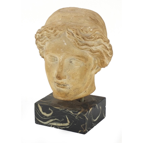 153 - Antique white marble bust of a female raised on rectangular black slate base, possibly Roman or Gree... 