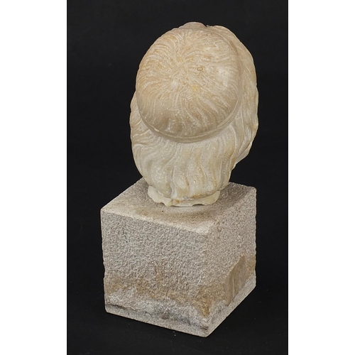 156 - Antique carved white marble bust of a bearded man raised on a square block base, possibly Roman or G... 