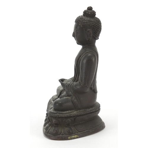 117 - Chino Tibetan patinated bronze figure of seated Buddha, 10.5cm high