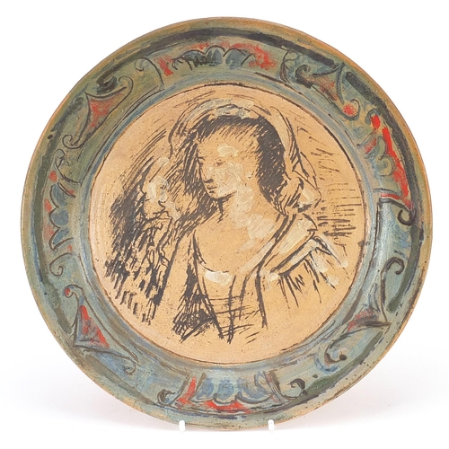 380 - Quentin Bell for Fulham Pottery, art pottery plate hand painted and incised with a portrait of a fem... 