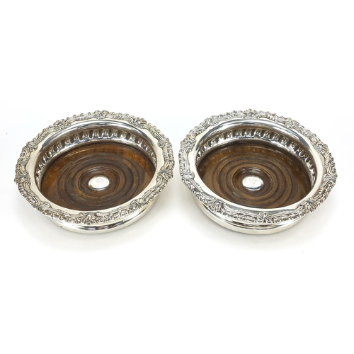 308 - Pair of silver plated wine coasters with Scottish Robinson Clan crests, 16cm in diameter