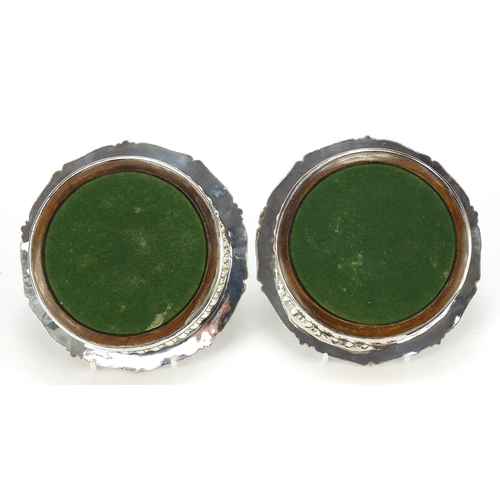 308 - Pair of silver plated wine coasters with Scottish Robinson Clan crests, 16cm in diameter