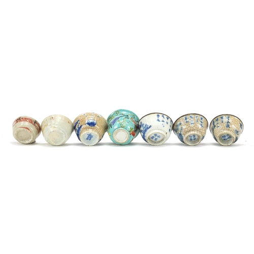 13 - Seven Chinese porcelain tea bowls, including four blue and white examples, the largest 3.5cm high