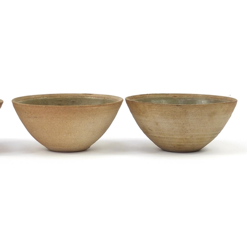 394 - Four St Ives studio pottery celadon glazed bowls, each 15cm in diameter