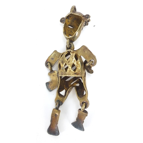 300 - Antique bronze articulated model/pendant of a man housed in a fitted leather case, 12cm high