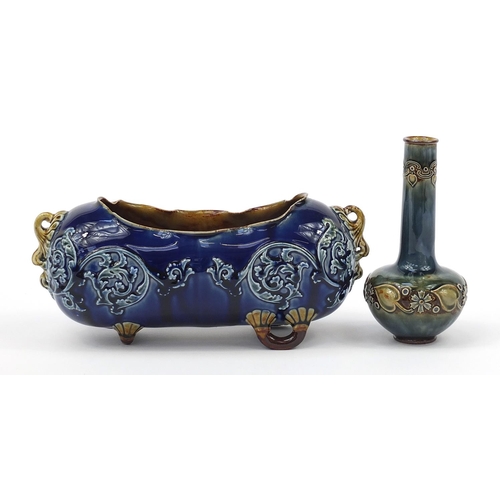 374 - Doulton Stoneware planter and a bottle vase each hand painted with stylised flowers, the largest 28c... 