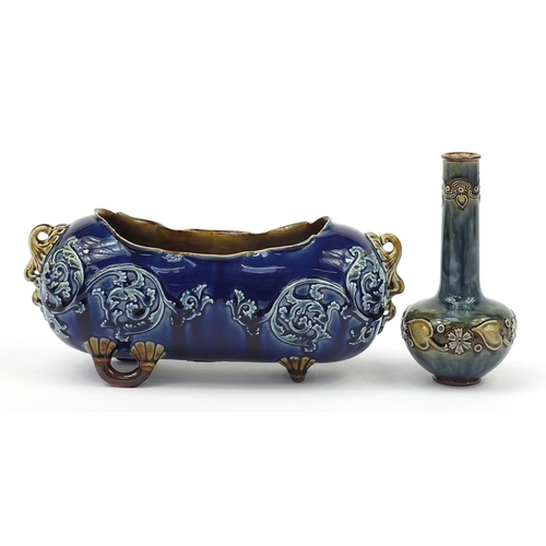 374 - Doulton Stoneware planter and a bottle vase each hand painted with stylised flowers, the largest 28c... 