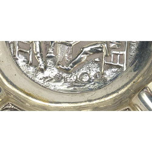 2327 - Three Dutch silver ashtrays embossed with figures in a tavern and one other, the largest 9.5cm in di... 