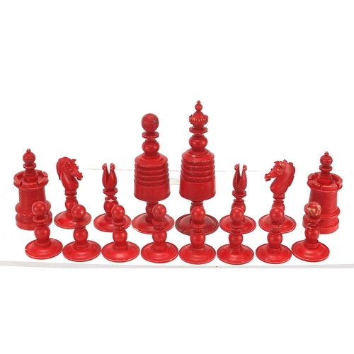 332 - Half stained carved bone chess set, the largest piece 9.5cm high