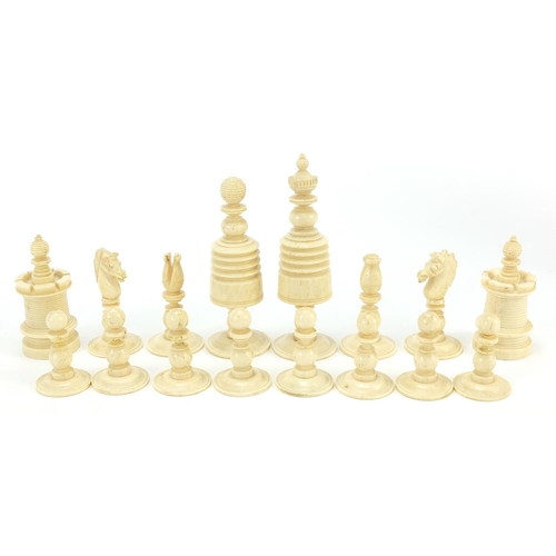 332 - Half stained carved bone chess set, the largest piece 9.5cm high