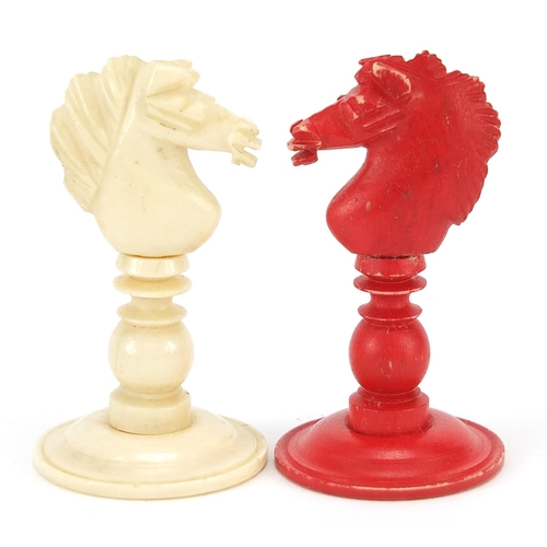 332 - Half stained carved bone chess set, the largest piece 9.5cm high