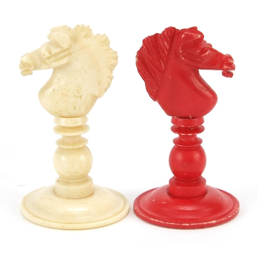 332 - Half stained carved bone chess set, the largest piece 9.5cm high