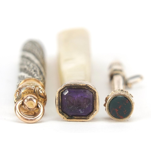 298 - Antique objects comprising mother of pearl and amethyst intaglio seal, unmarked gold propelling penc... 