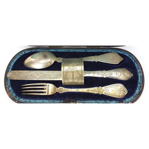 2425 - Victorian silver four piece christening set comprising knife, fork, spoon and napkin ring housed in ... 