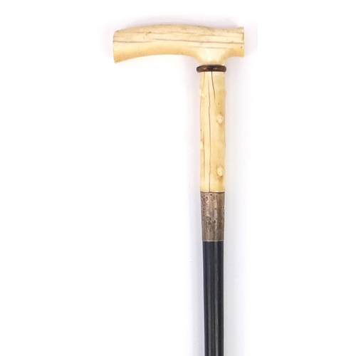 320 - Ebonised walking stick with ivory handle and silver collar concealing a corkscrew, 87cm in length