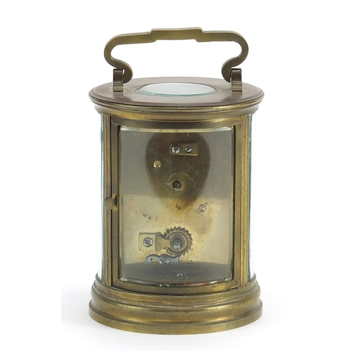 267 - 19th century French circular brass carriage clock with bevelled glass and enamelled dial having Roma... 