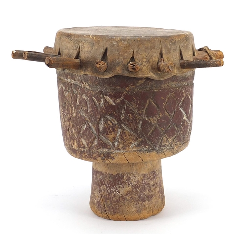 191 - Tribal interest drum carved with geometric motifs, 29cm high