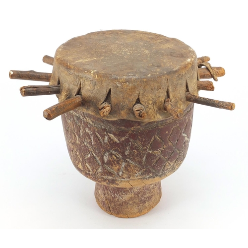 191 - Tribal interest drum carved with geometric motifs, 29cm high