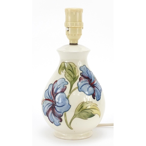 396 - Moorcroft magnolia baluster table lamp, paper label to the base, 27cm high