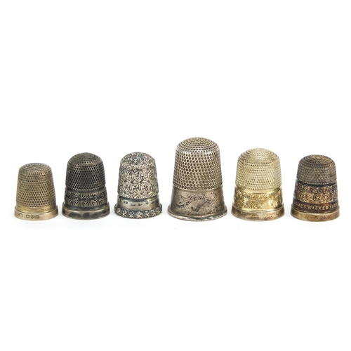 2418 - Six silver thimbles, various hallmarks including Charles Horner, the largest 2.7cm high, total 23.0g